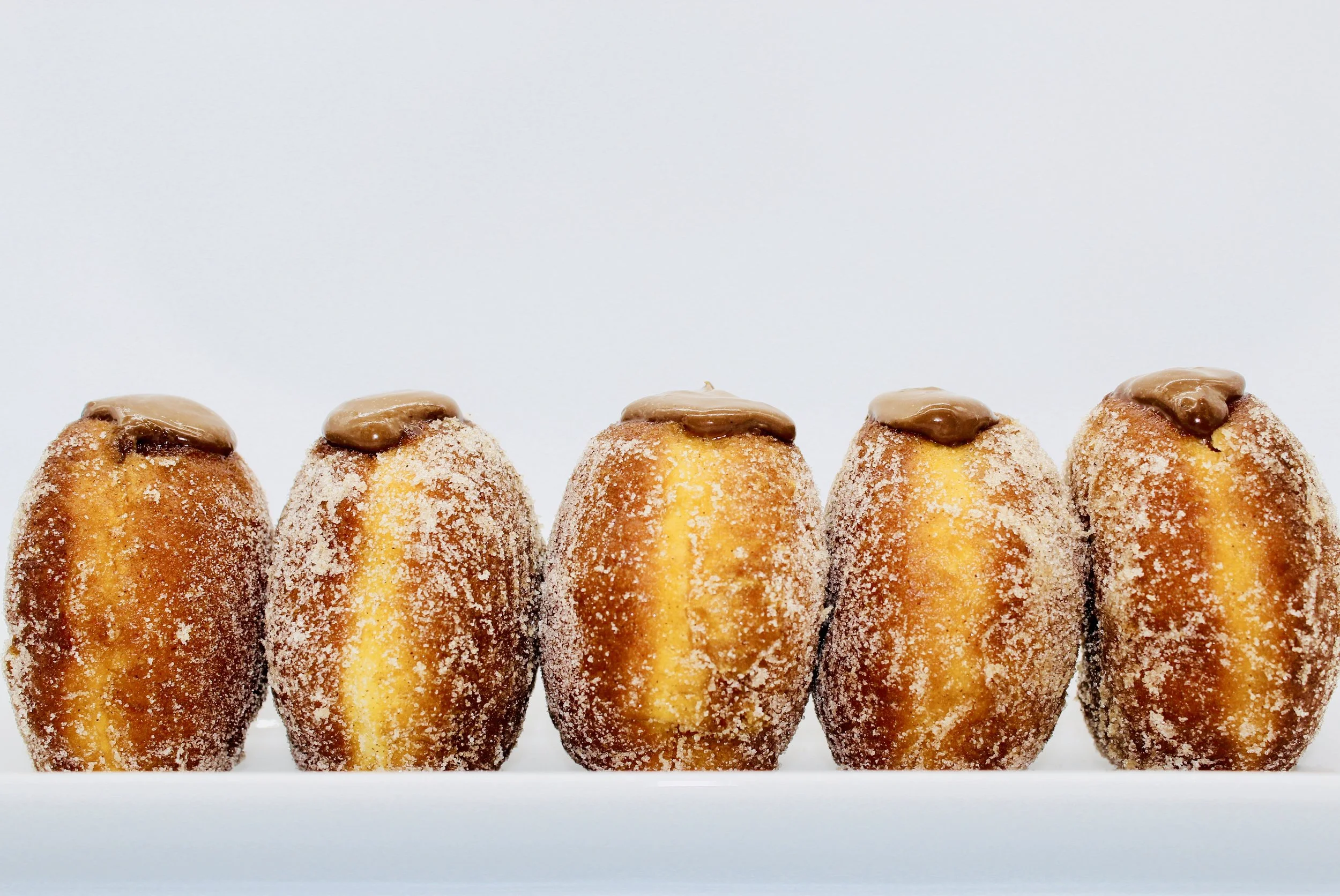 Cinnamon Doughnuts filled with Chocolate Custard