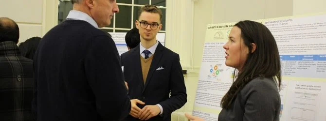 Zachary German and Frances Robinson, MPA graduate students presenting Project 2Gen CIPA Capstone project.