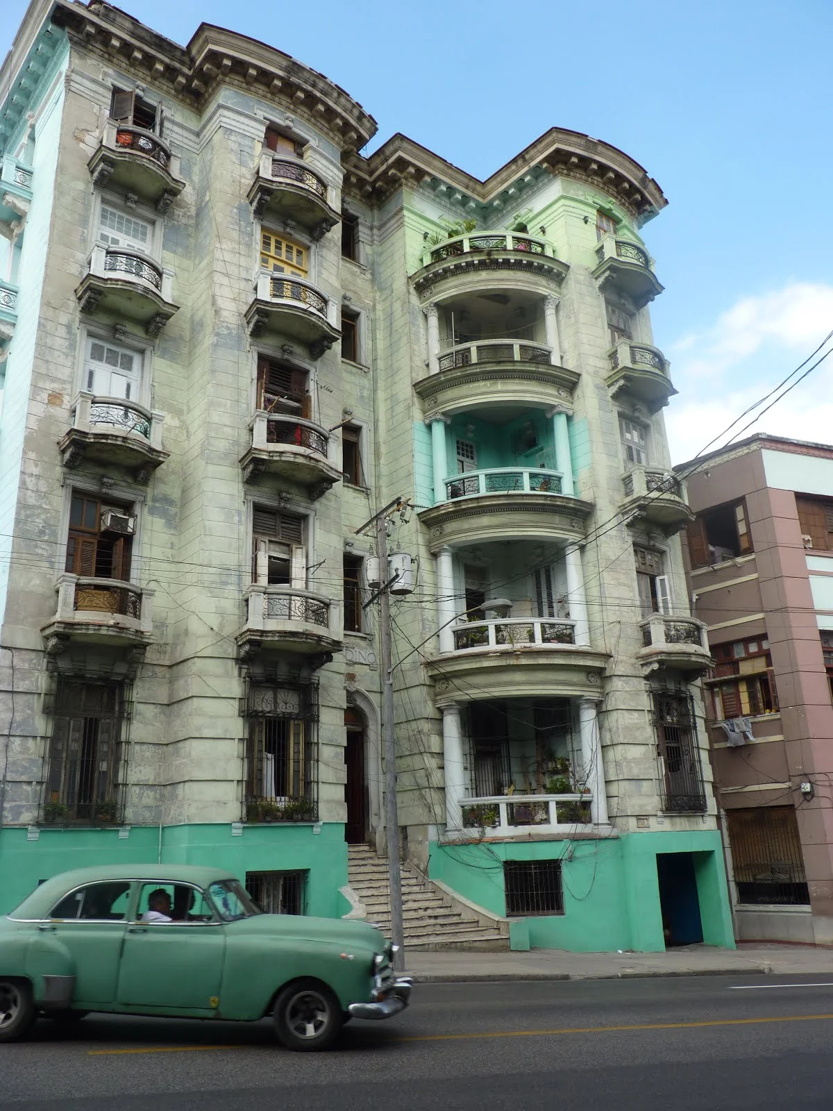 Often times the vivid colors of the cars would match the painted buildings.