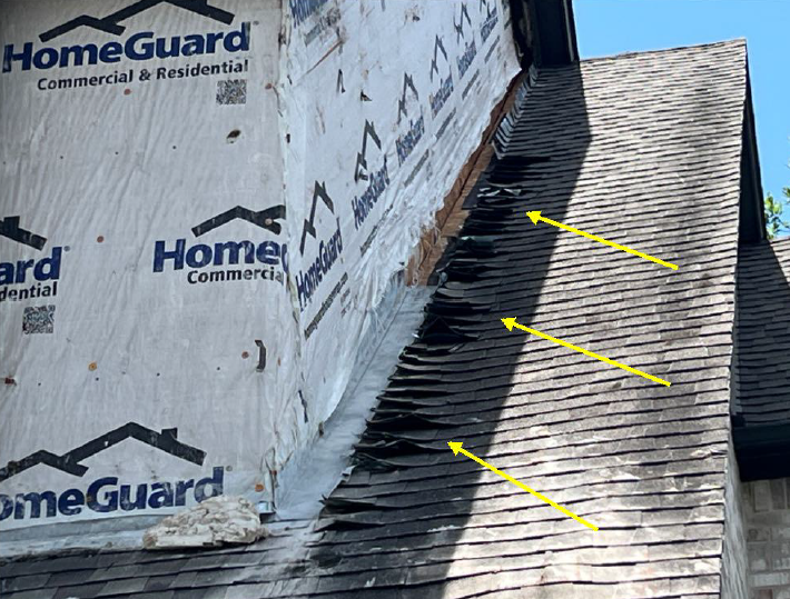 Roof shingles damaged due to brick