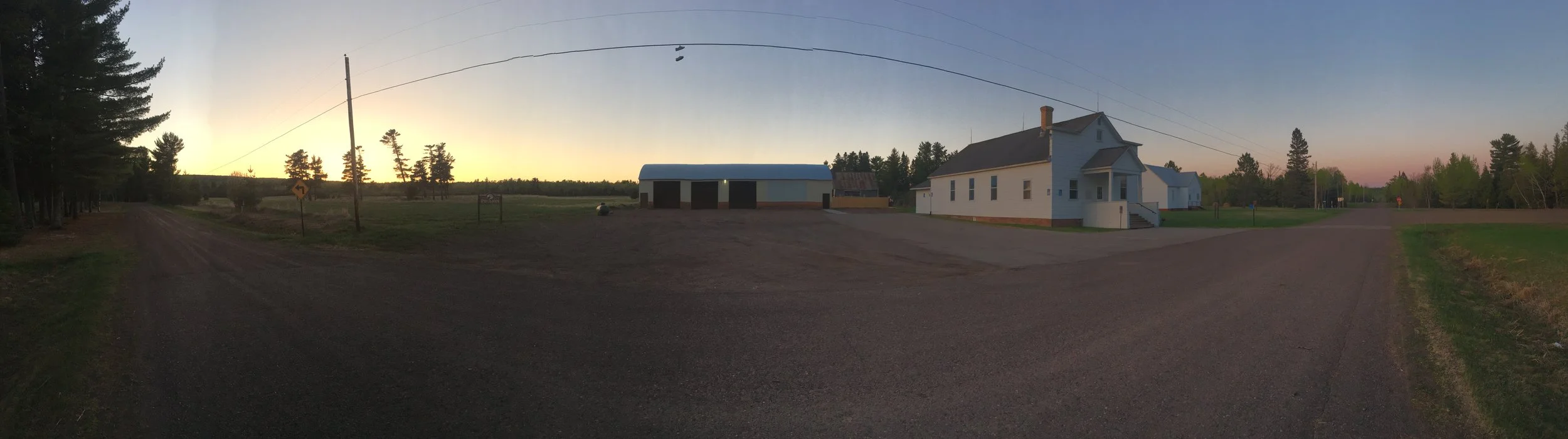 The grounds for Boreal Bliss Yoga Fest! Master classes will be held in the large enclosed building with three garage doors. The venue has beautiful vaulted ceilings, knotty pine walls, and a little stage for the ultimate blissful setting. Depending on the weather, vendors will be outside/in the white town hall building on the right. There is plenty of green space to roam around and enjoy a picnic! Photo by Stacy Nightwine