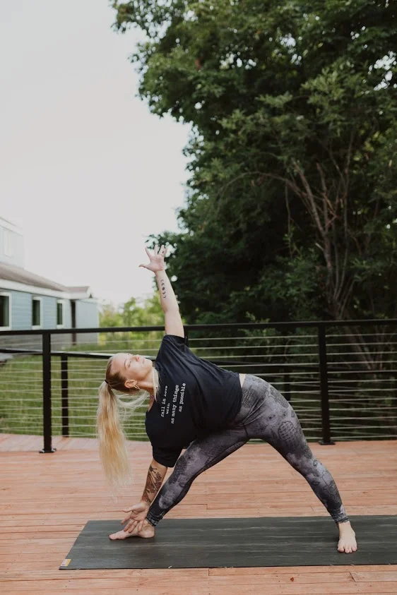 Triangle Pose Left (Trikonasana) Turn right foot in slightly and left foot directly out to the side. Align your left heel with the arch of your right foot. Keep legs engaged while inhaling to extend the spine and then exhaling and bending to bring left hand to left ankle and reaching right arm up to the sky. You may use a block under the left hand. Turn your head to look up at your hand. Hold for several breaths before engaging your legs toward one another to lift up and out of the pose.