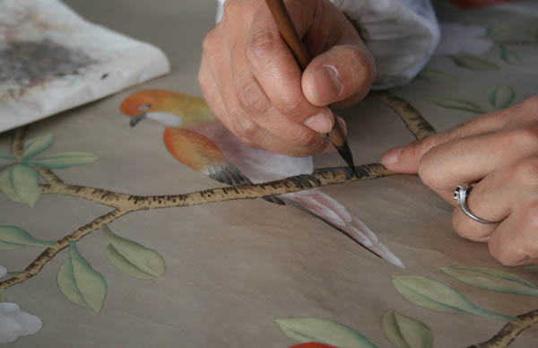 The painting process involves the addition of more and more layers of colour