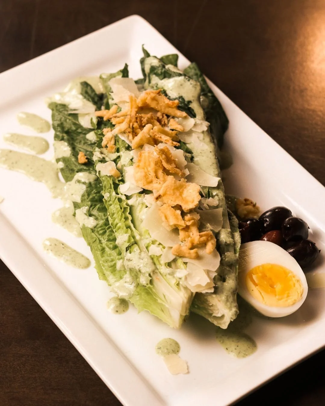 Spring on a plate 🌿🥗
Our Green Goddess Caesar is fresh, crisp, and full of flavor &mdash; romaine hearts, hard-boiled egg, kalamata olives, shaved parm, and crispy fried onions, all finished with our house green goddess dressing.

Light, bright, an