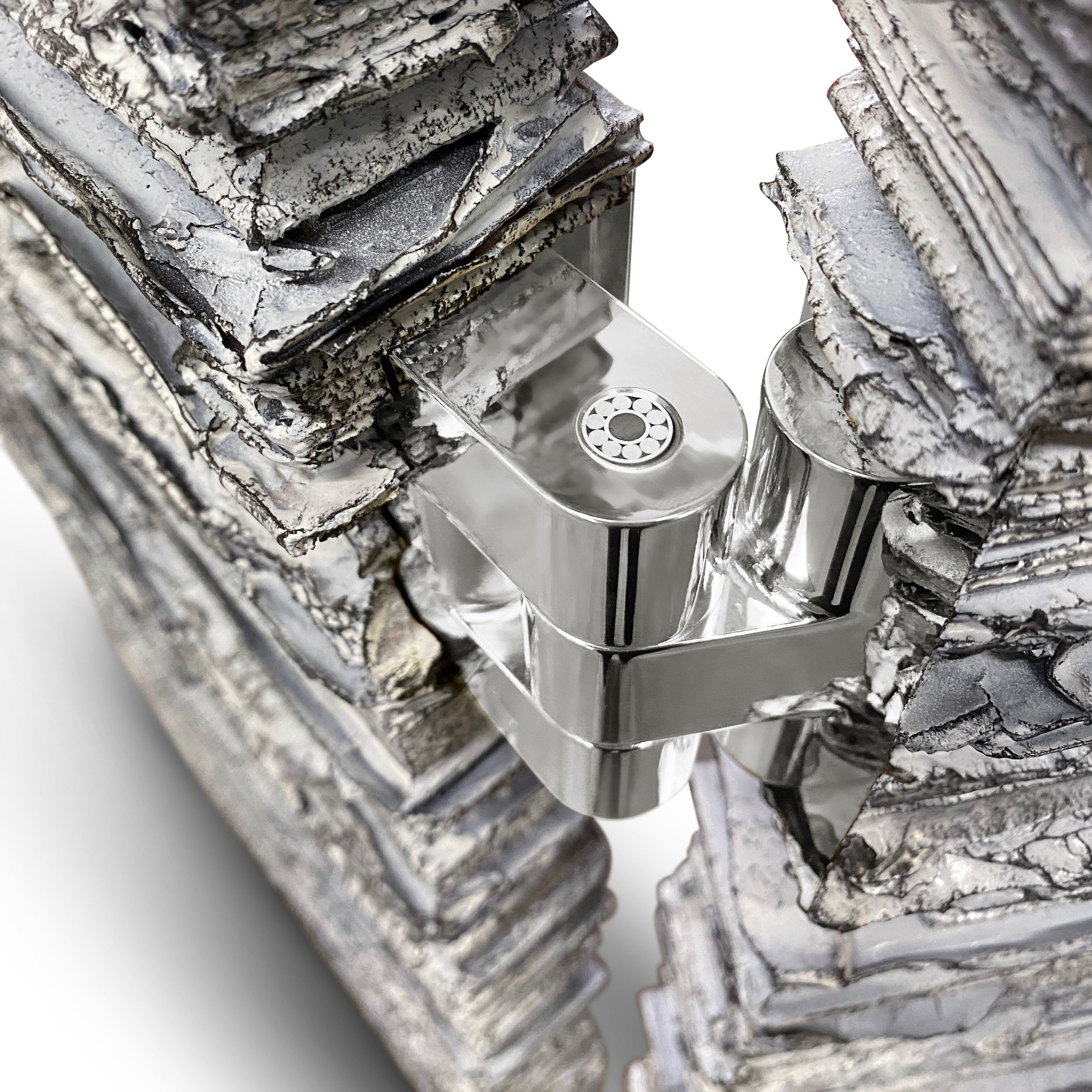 Sculpted surface and polished hinge detail of a Sarcomere Paravent