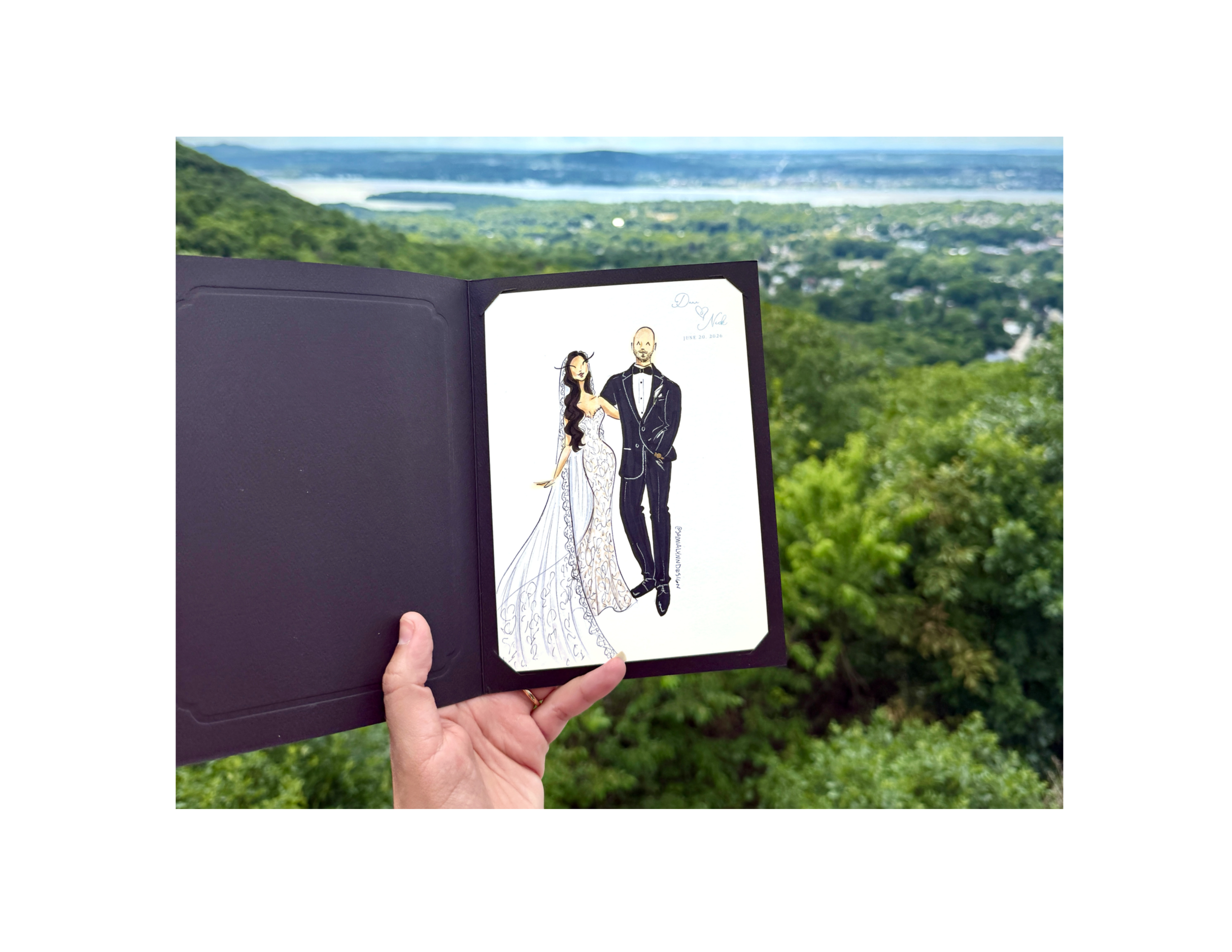 An illustration of a bride and groom on white paper in a black booklet