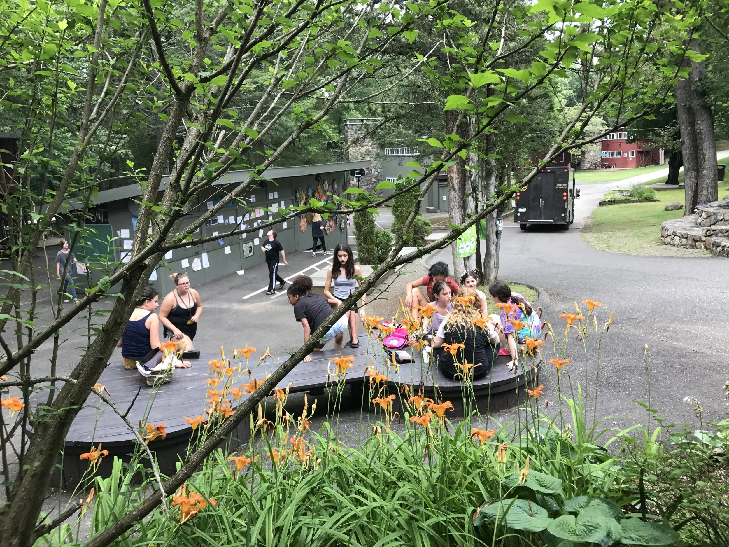 View from The Porch of The Dogbone, a popular hangout spot in front on the Dining Hall, with The Canteen, Bulova House, and Simon House in the background.