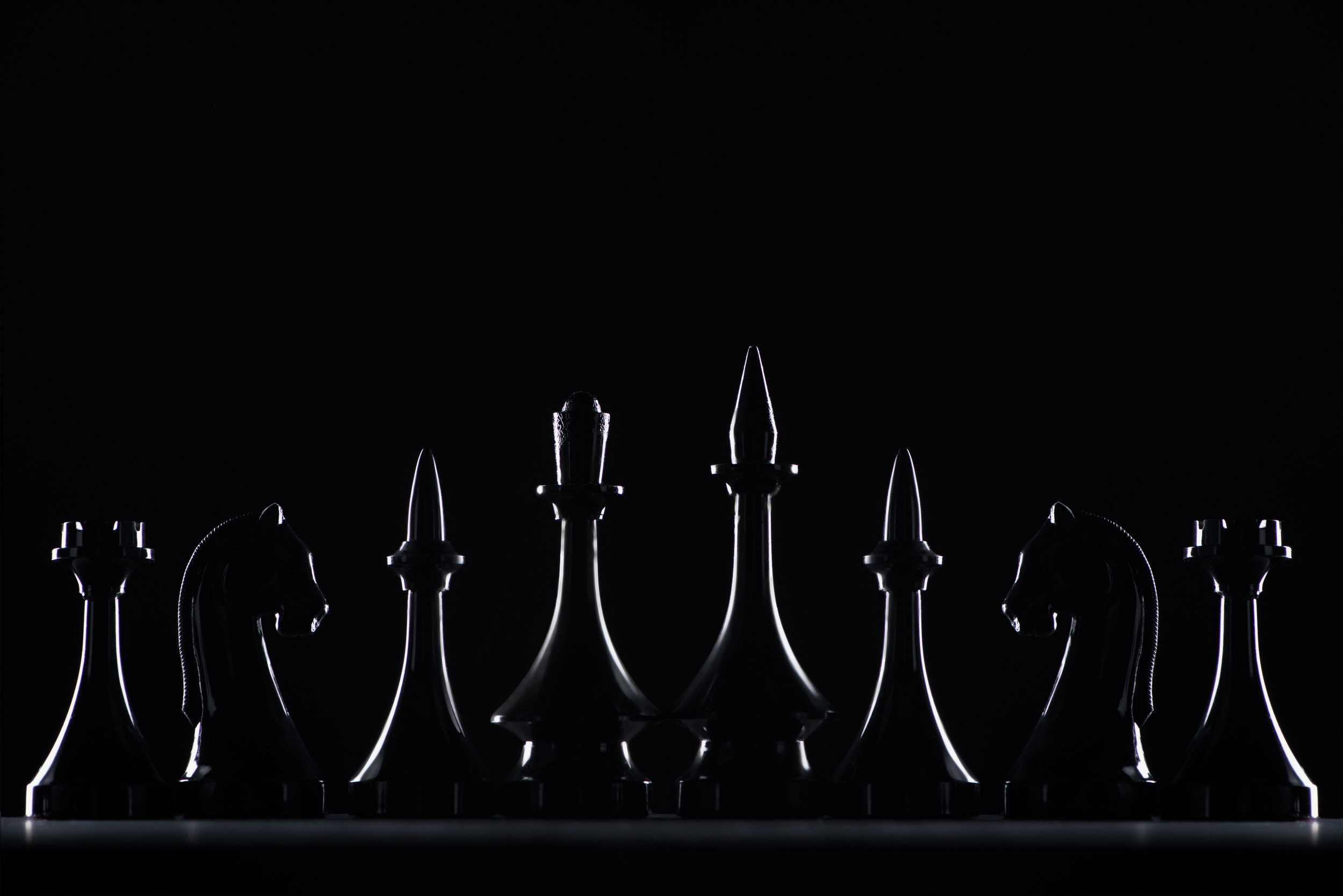 silhouettes-of-chess-figures-isolated-on-black,-business-concept-961395930_7171x4785.jpeg
