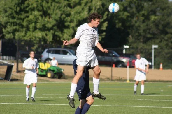 Winning a header for my high school team while maintaining a flattering face. 