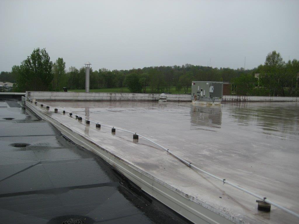 The project at Brasee Hall and Herrold Hall, both on Ohio University’s Lancaster campus, involved a partial roof replacement on each building. Brasee Hall originally opened in 1968, and Herrold Hall was built in 1976. The existing roofs were a built-up roofing assembly with an overlaid elastomeric sheet (EPDM) roofing system. The roofing membranes were completely removed and the insulation assembly was removed down to the existing metal decking. The new roof systems consist of rigid insulation, coverboard, and a new 60 mil EPDM roofing membrane. The work also includes new metal flashings associated with the new roofing.