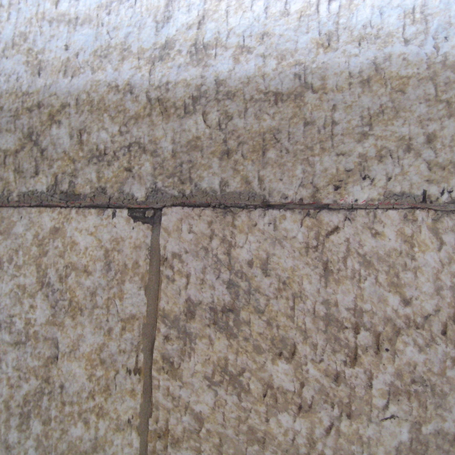 At mortar joints between terra cotta units, either mortar is completely missing or is cracked and is loose within the joint. Or, mortar is attatched to one unit, but the adjacent unit has pulled away from the joint.