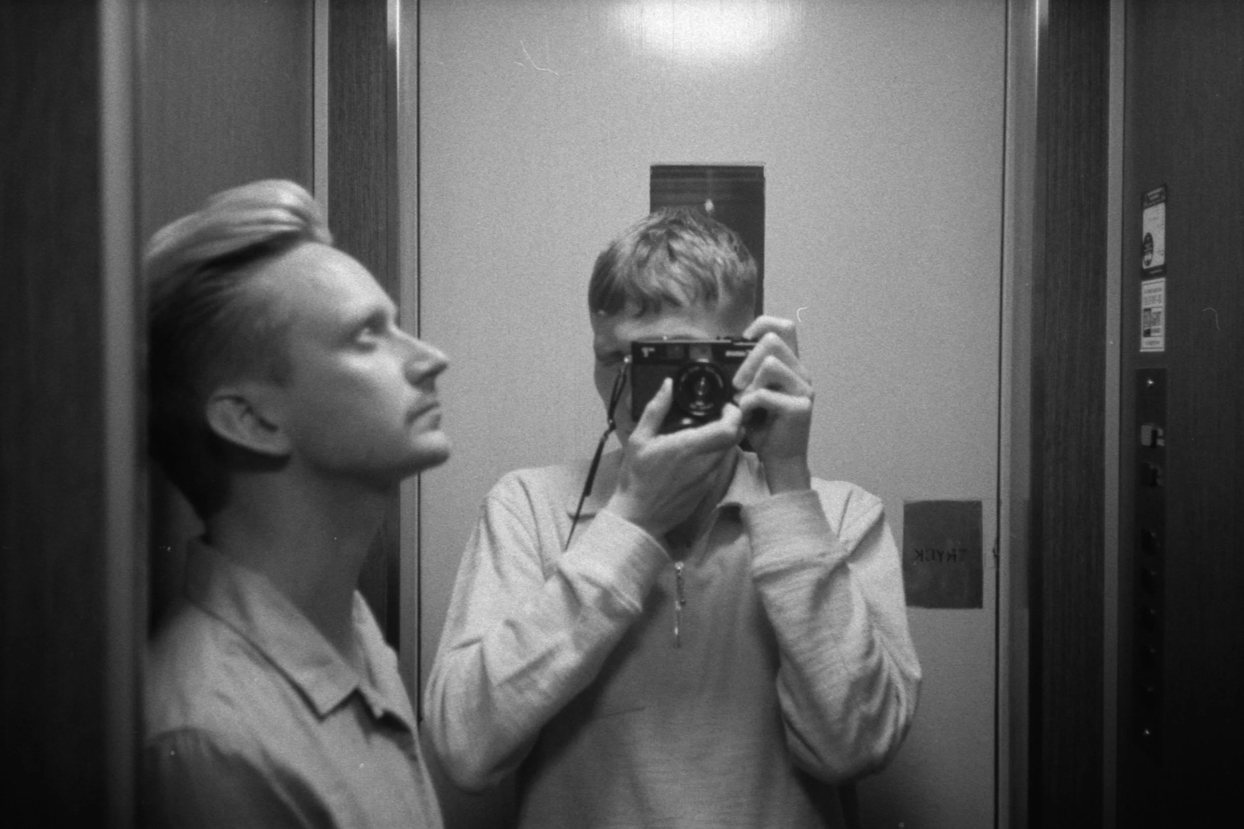Elevator self-portrait, August 24 2019 (Canon A35F, Ilford HP5 400)
