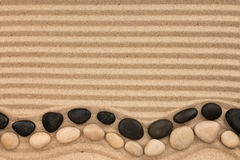 two-rows-stones-black-white-lying-striped-sand-space-text-view-above-92806847.jpg