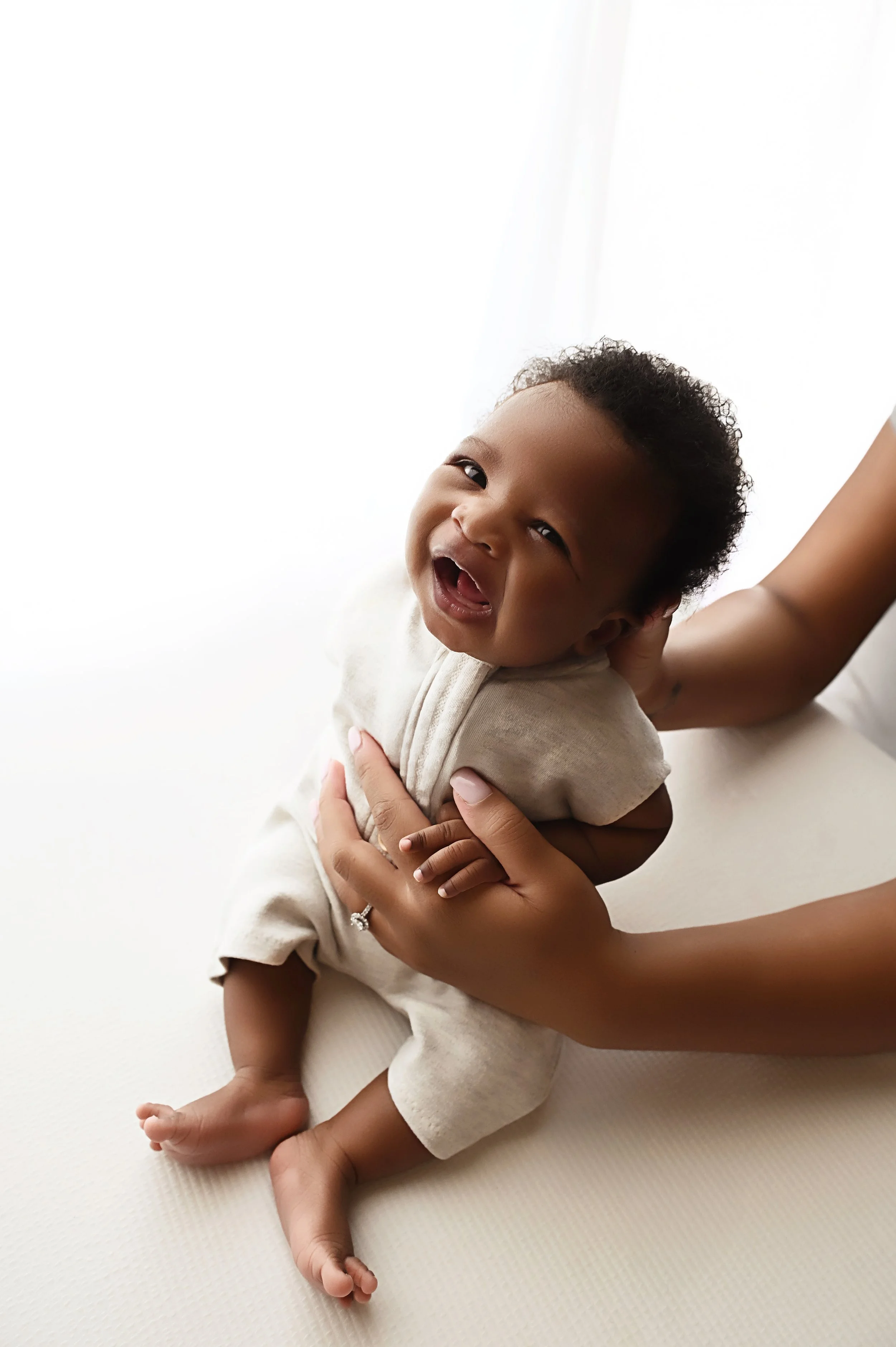 5 week old baby boy smiling during studio newborn session in Shreveport Louisiana