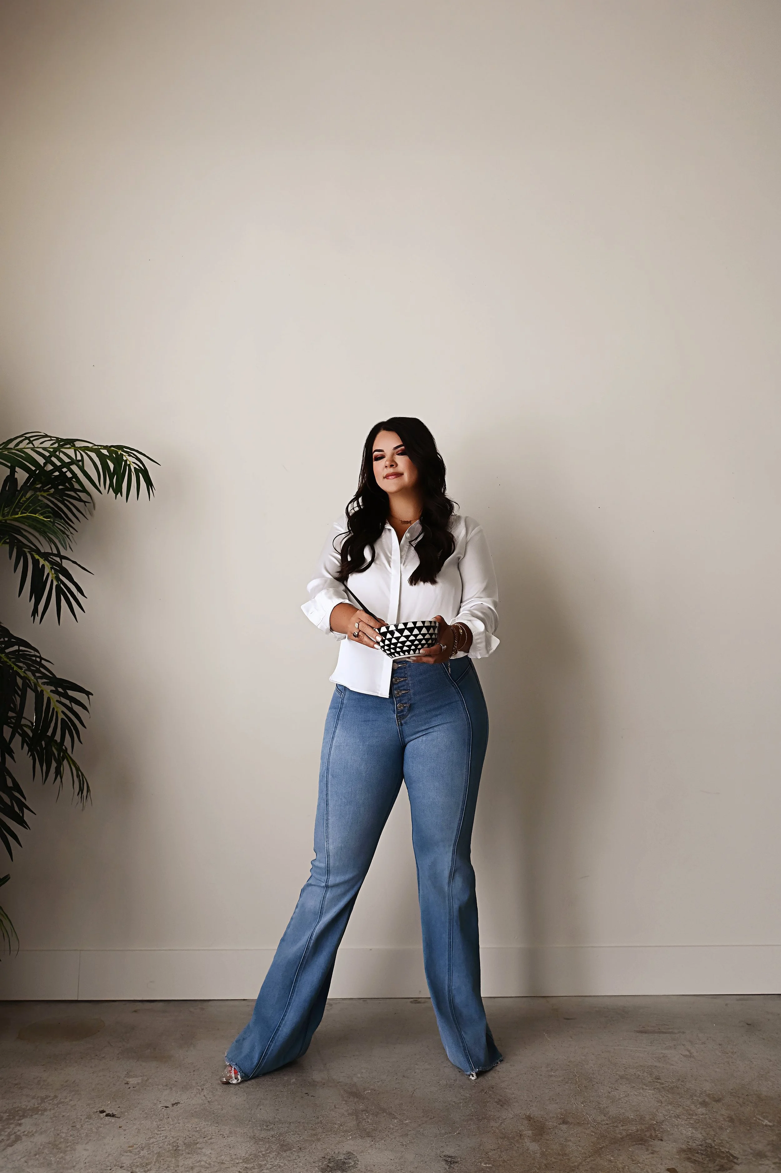 Full body branding photo of Shreveport hair stylist Britney standing confidently in studio