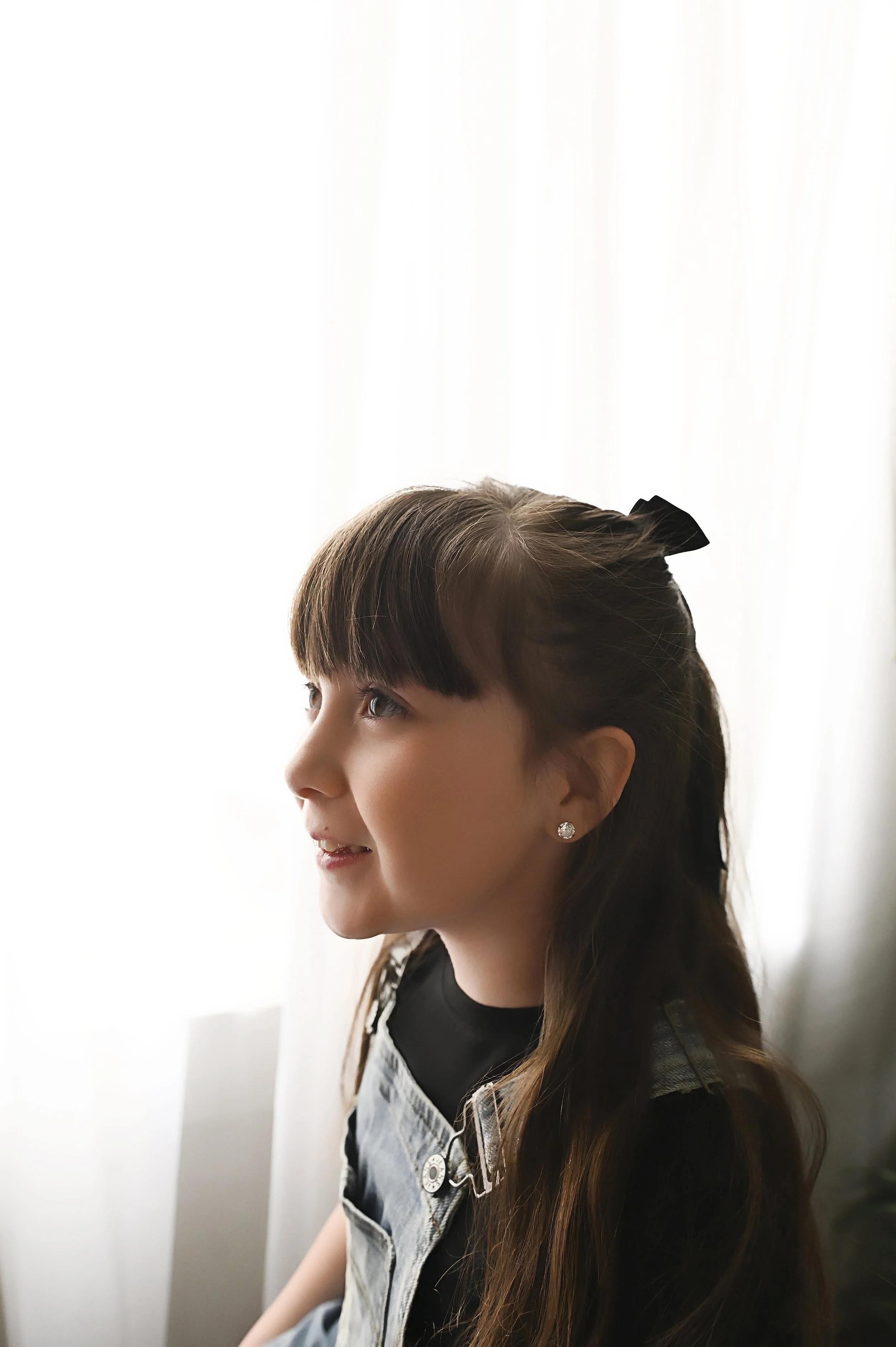 young girl portrait in natural window light during storytelling photography session