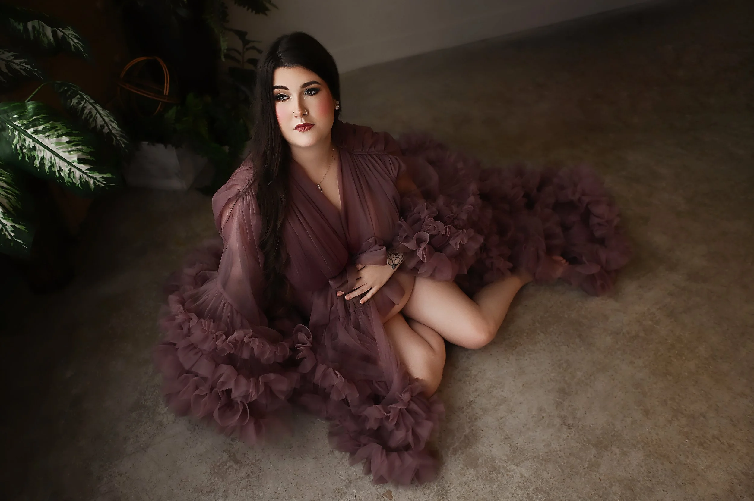 Luxury maternity portrait of a pregnant woman wearing a tulle gown in a Shreveport studio