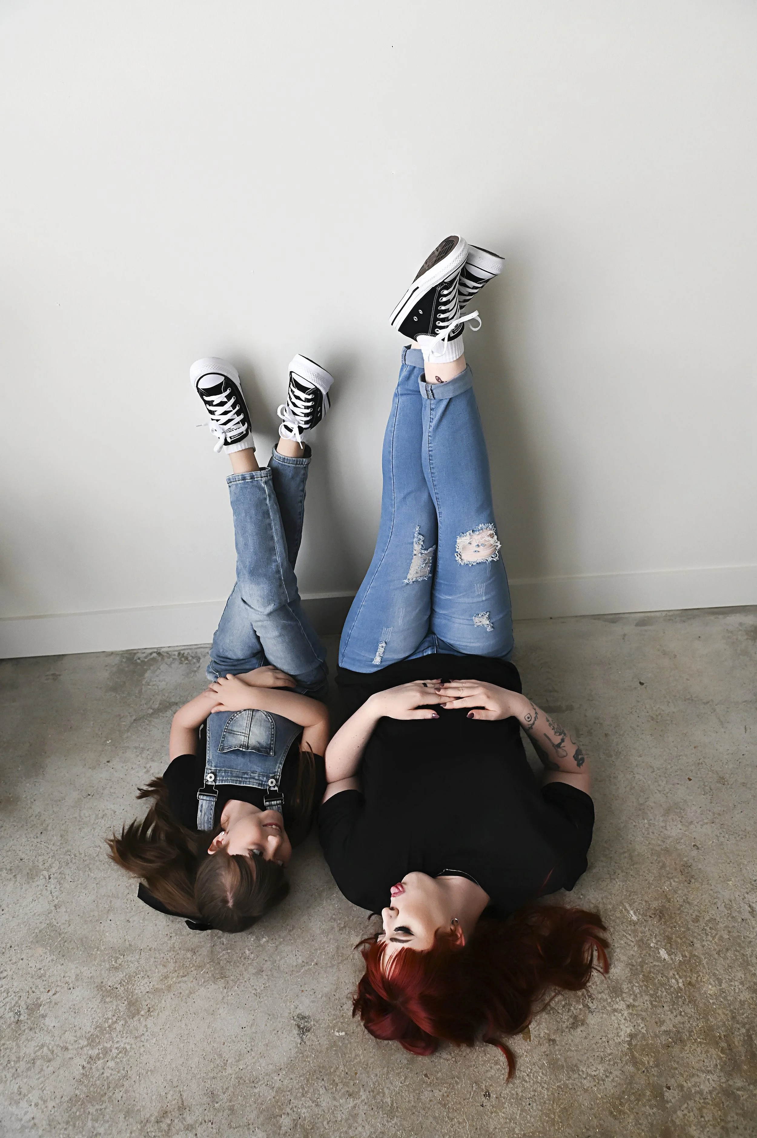 candid mother daughter portrait with matching Converse shoes during lifestyle photography session