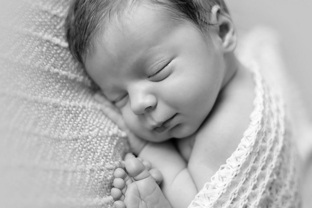 Black and White infant picture during newborn session in San Diego CA