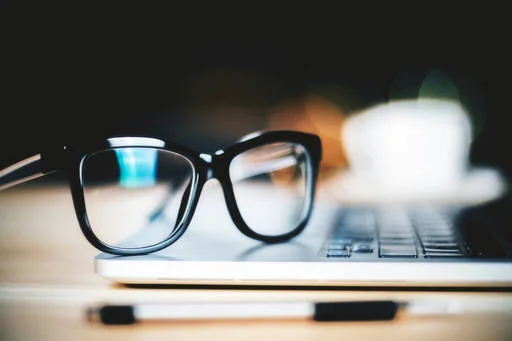 glasses on laptop keyboard.jpeg