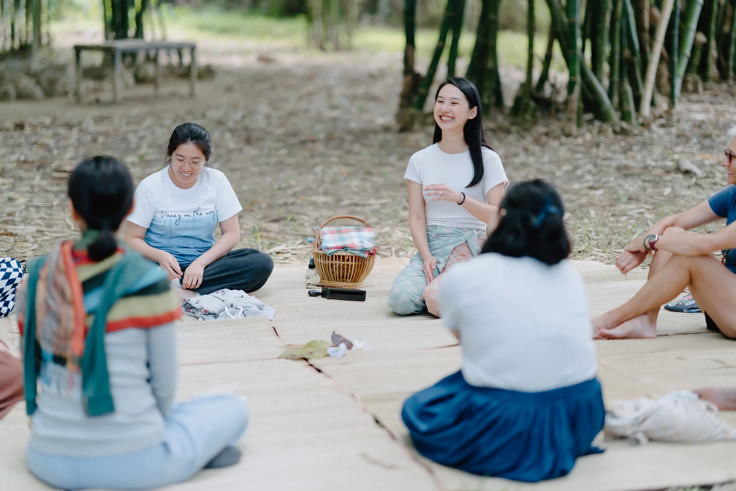 Youmin smiling as she leads a forest therapy / forest bathing retreat