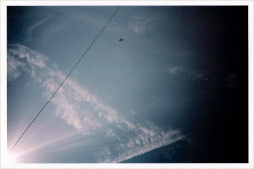I took this when we were lying on our backs on the roof of our old house. 2005.