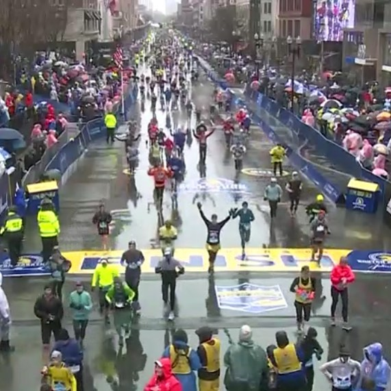FINISH! Right in the center, arms up, yellow skirt, ugly crying.