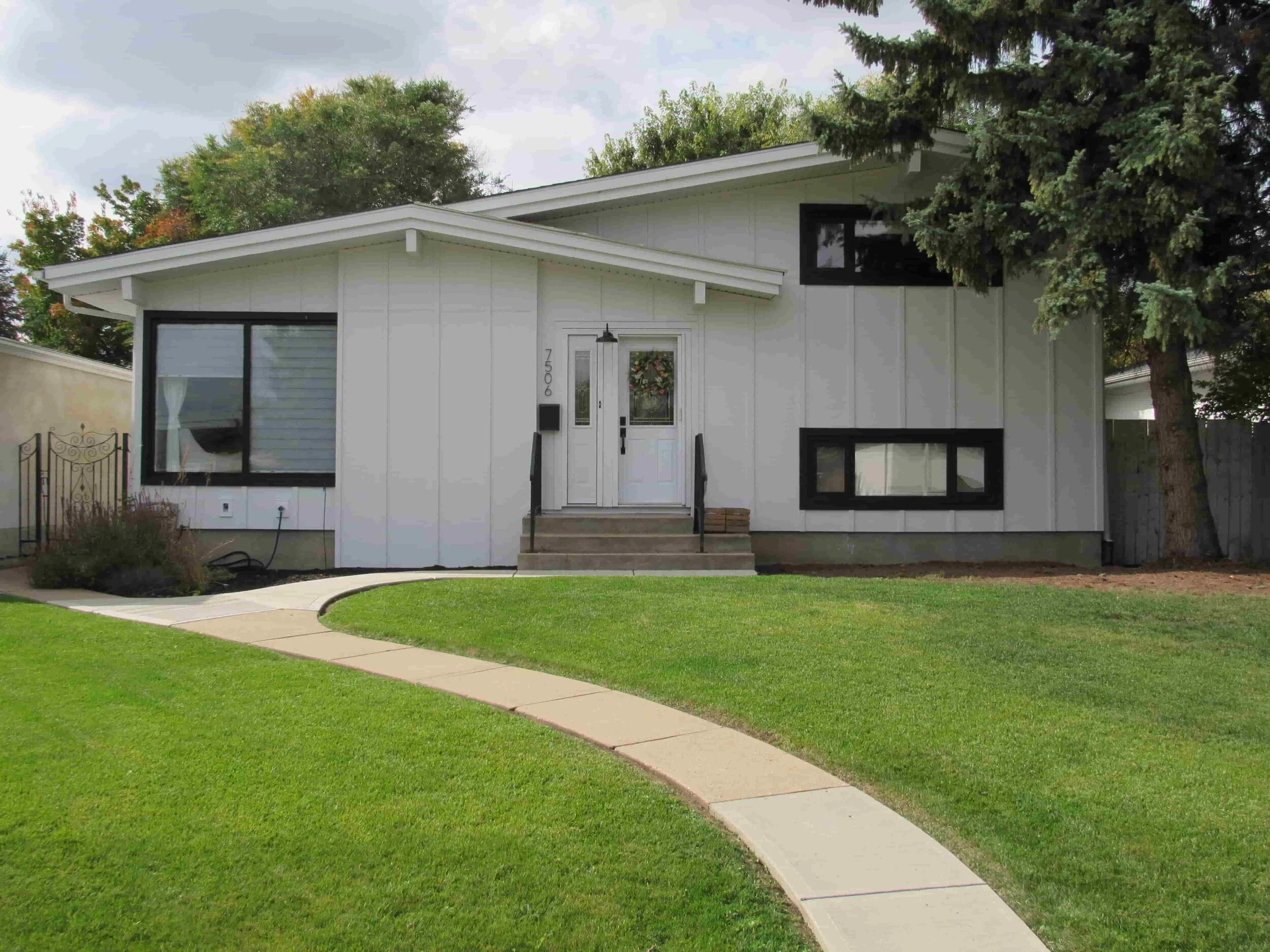 Siding: James Hardie Arctic White Trim: James Hardie Midnight Black