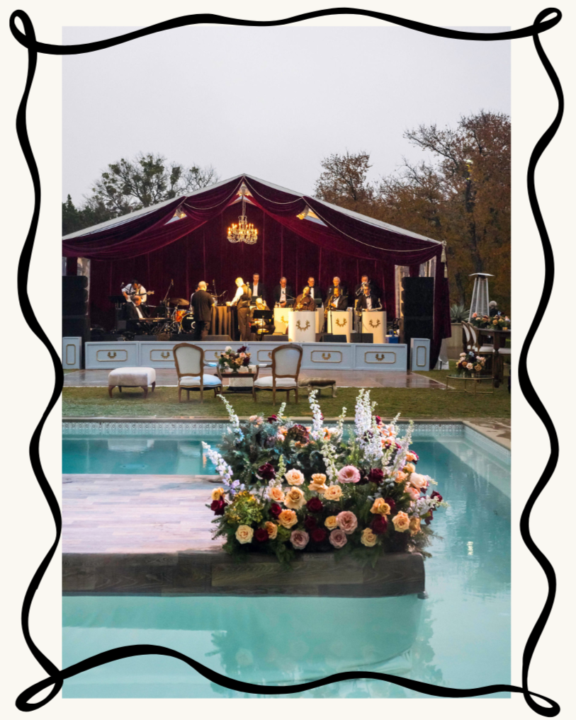 Poolside celebration with a burgundy tent and floral installation featured in the Austin event design portfolio