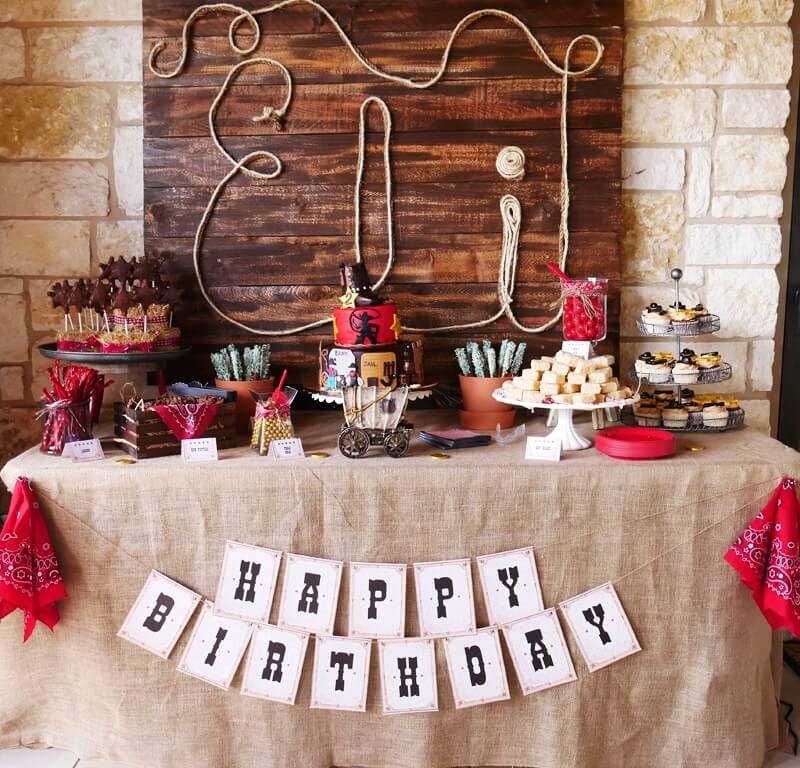 The best Cowboy or Wild West party idea, loving the wooden backdrop.