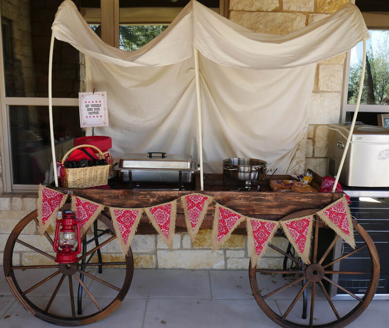 Cowboy or Wild West party decor ideas like this DIY wagon