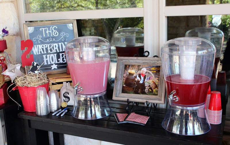 Drink station for a Cowboy theme party and a cute chalkboard sign