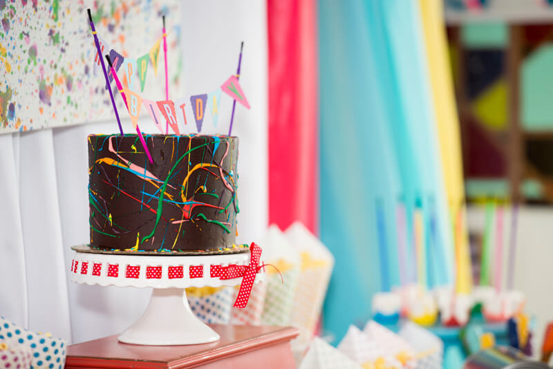 Cute colorful cake with paint splatter