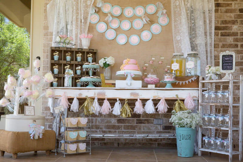 Cute dessert table with pastel colors and drink station