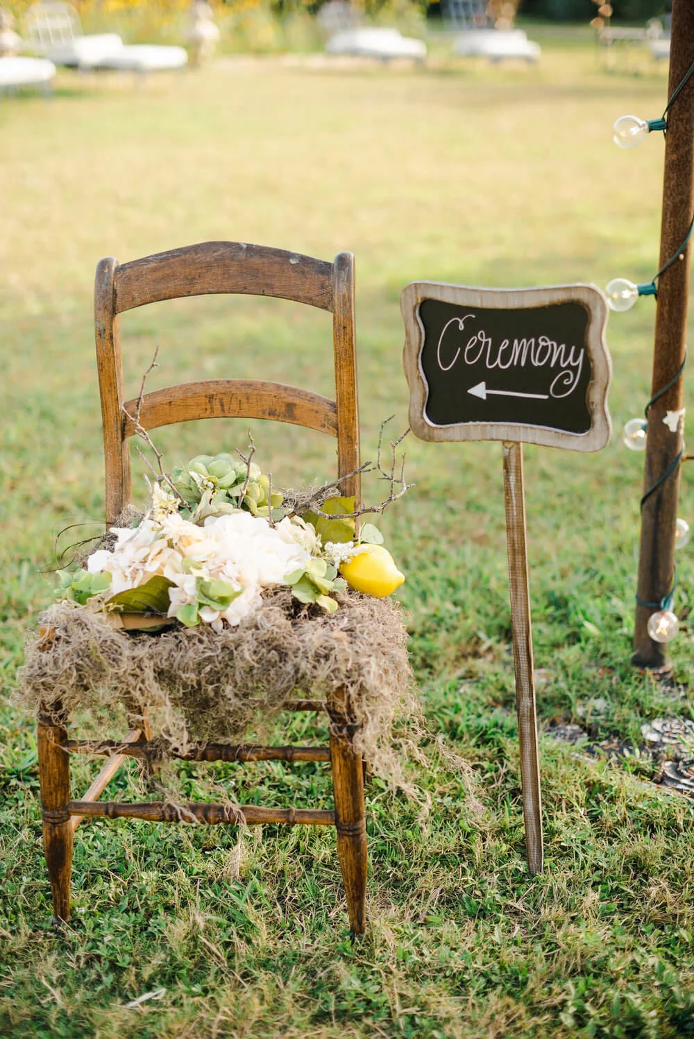 French country wedding inspiration ceremony sign, chalkboard, vintage chair, lemons, style.
