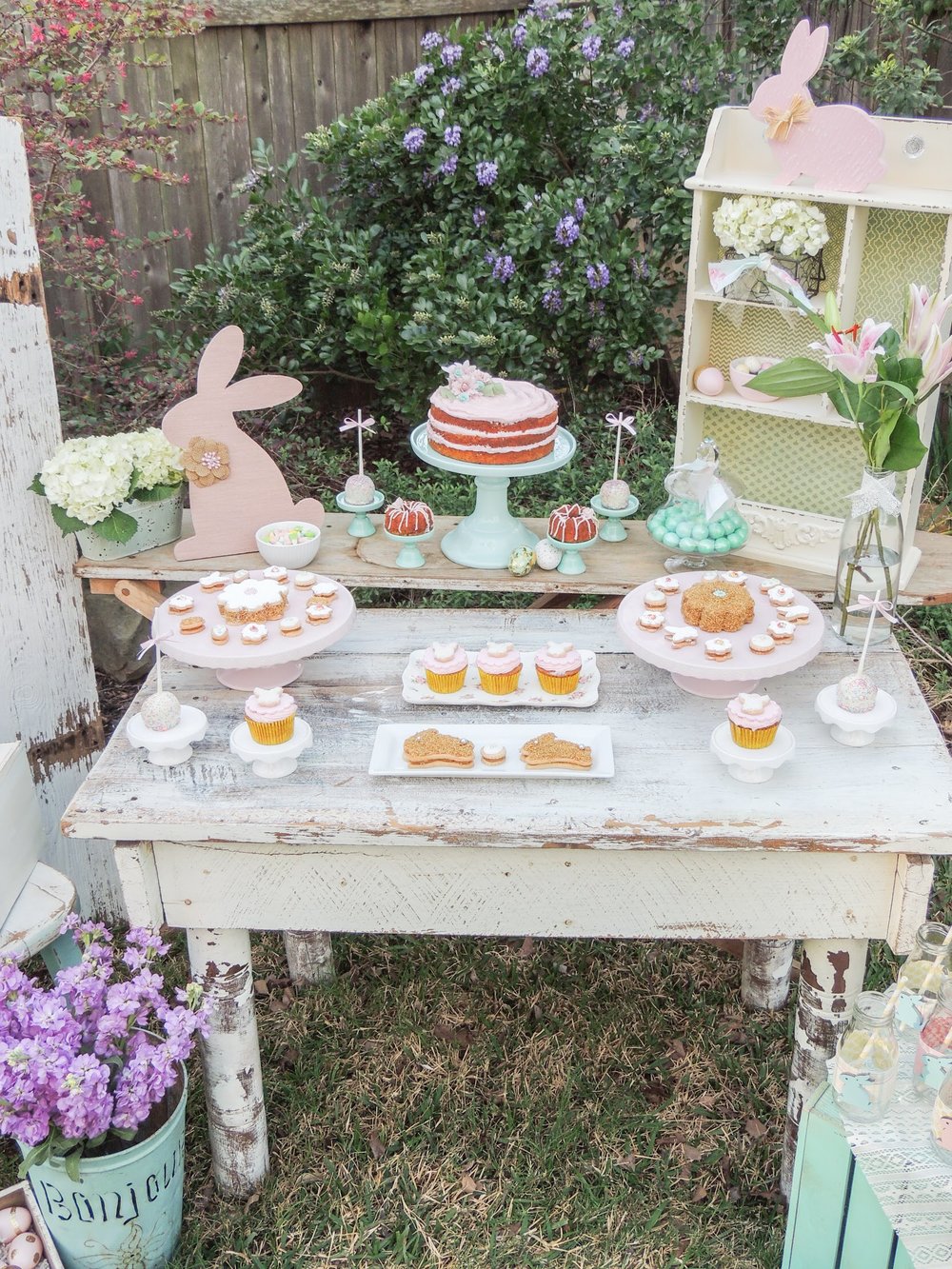 Gorgeously vintage and shabby chic Easter party in pretty pastels with a tiered carrot cake and mini bundt cakes. Styling by Austin Texas Party Planer Mint Event Design www.minteventdesign.com #eastertable #easterdecor #easterparty #partyideas #easterideas #easterdessert #shabbychic