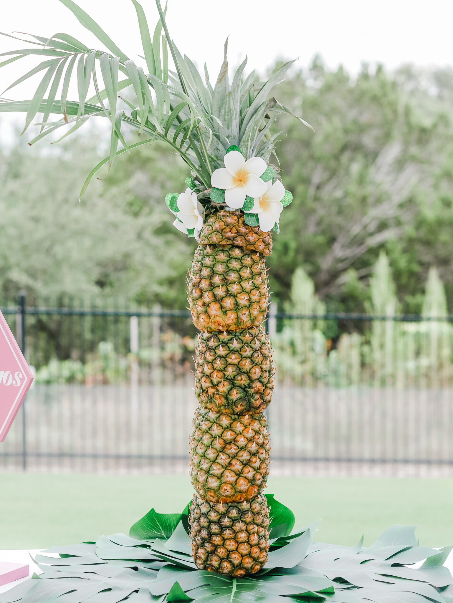  Surprise guests with a large tower of pineapples. Come see all the tropical party details on Mint Event Design www.minteventdesign.com 