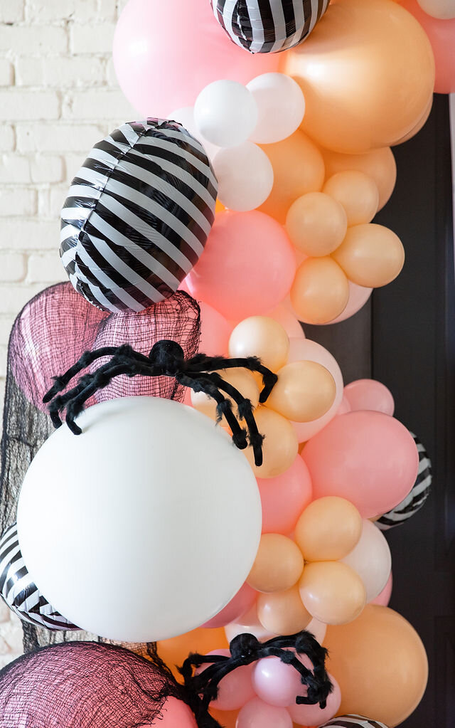 Balloon garland for a unique Pink Halloween Party - get all of the party details now at minteventdesign.com!
