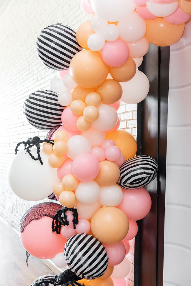 Balloon garland for a unique Pink Halloween Party - get all of the party details now at minteventdesign.com!