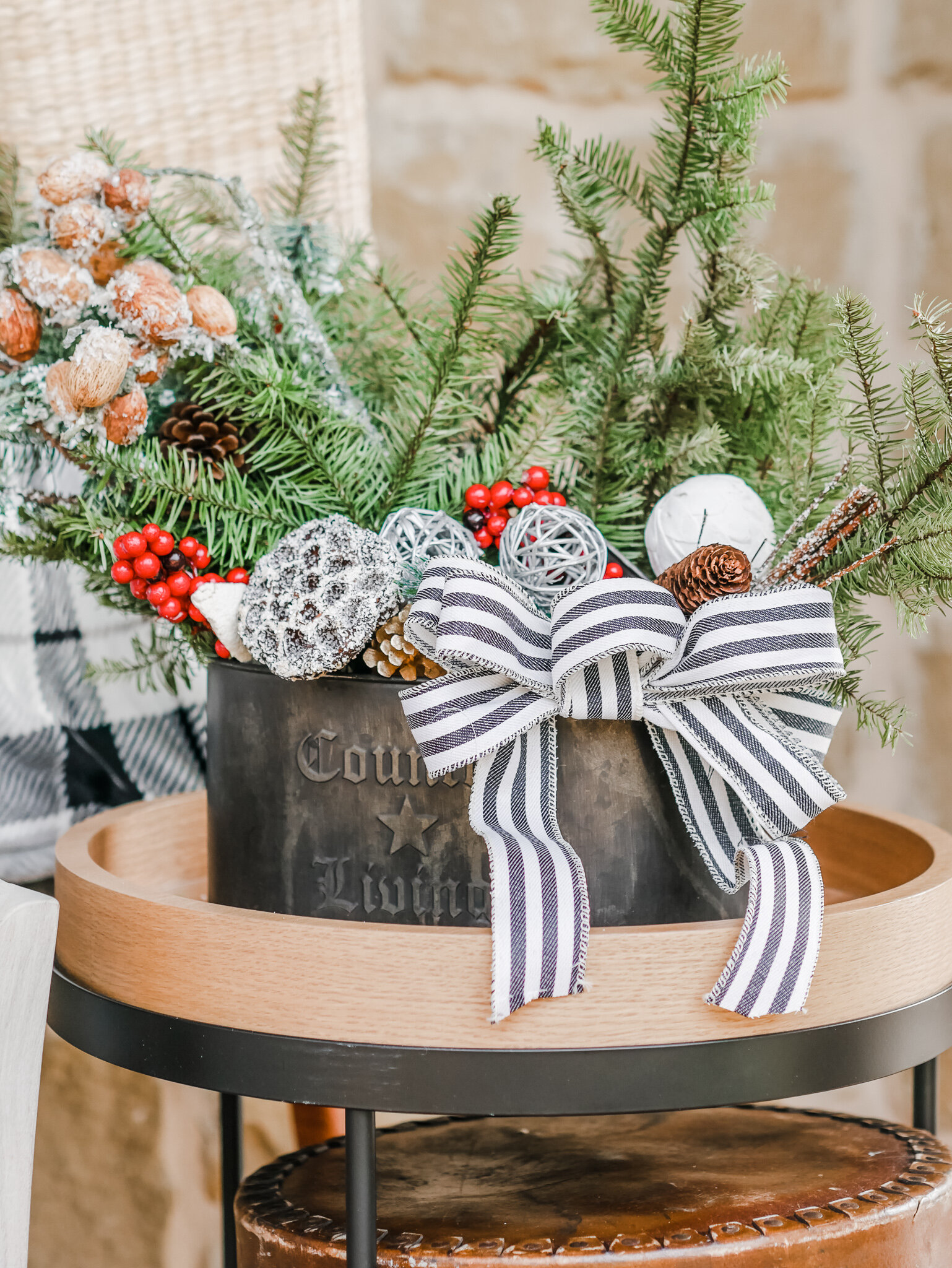 A modern farmhouse style Christmas porch designed by MINT Event Design in Austin, TX. Get more details and holiday decor ideas now at minteventdesign.com!