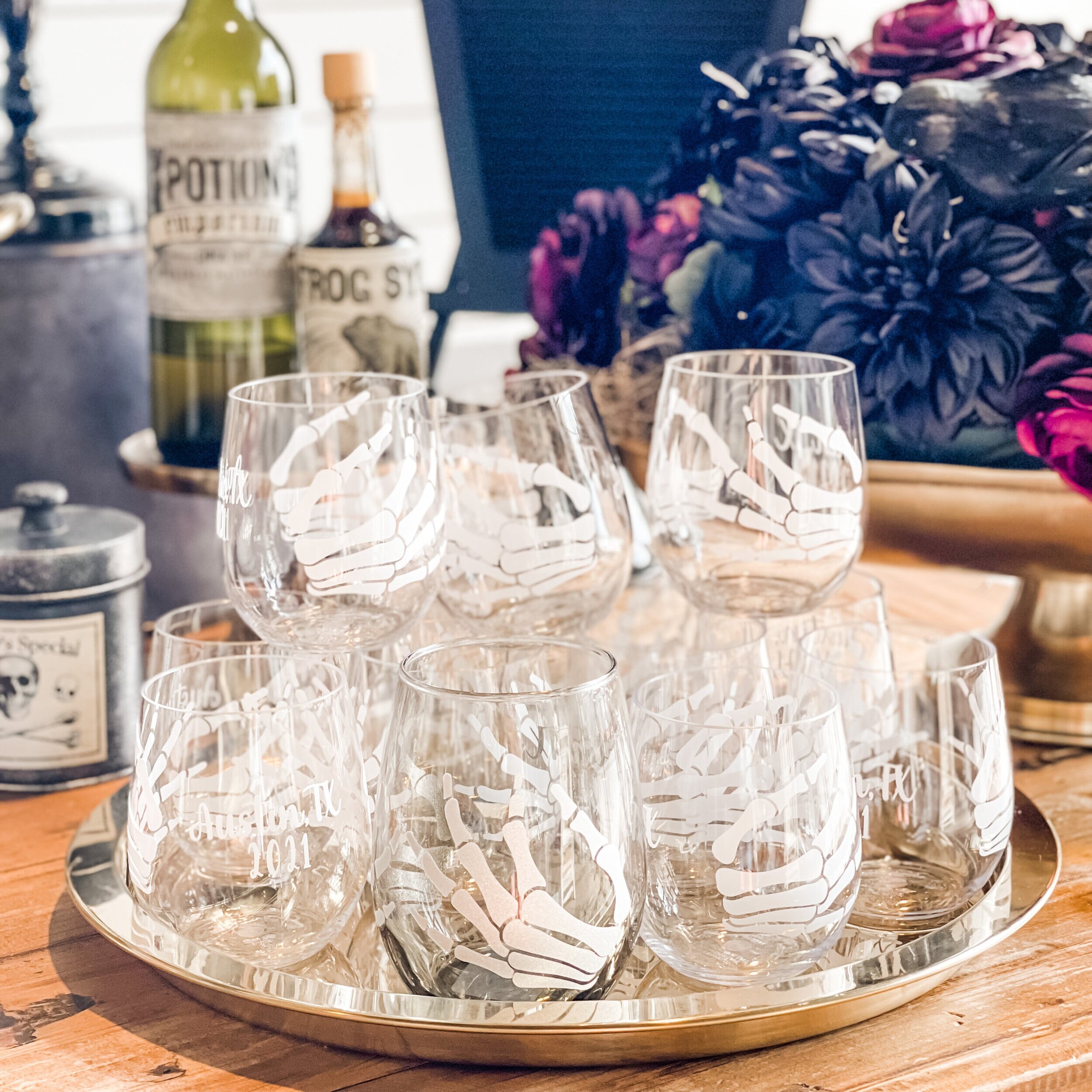 Throw a fun “Death to my Twenties” 30th Birthday Party with personalized skeleton wine glasses! Get ideas for welcome area, food bar, decor and more now at minteventdesign.com!