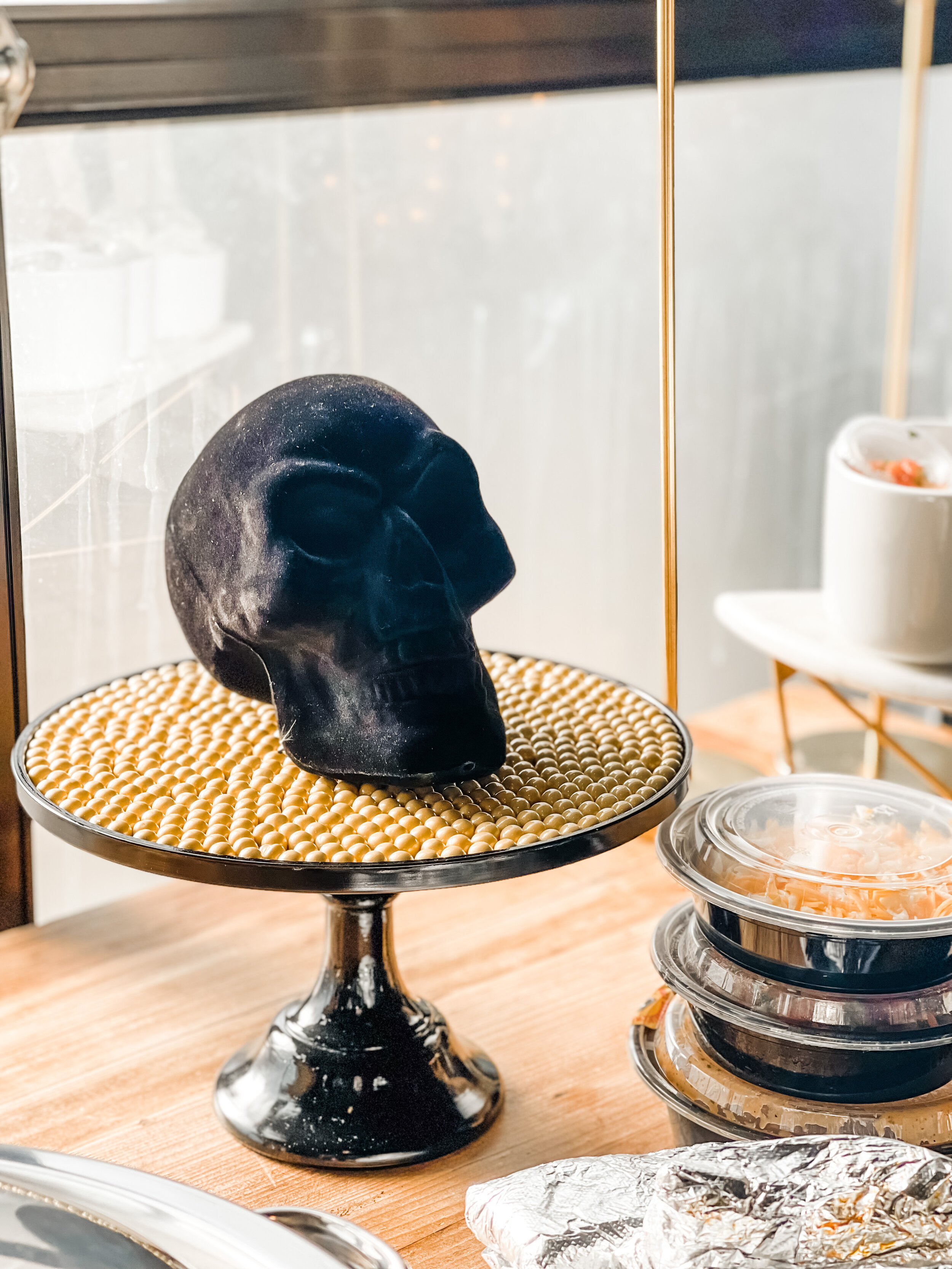 Throw a fun “Death to my Twenties” 30th Birthday Party with dark and mysterious skull decor! Get ideas for welcome area, food bar, decor and more now at minteventdesign.com!