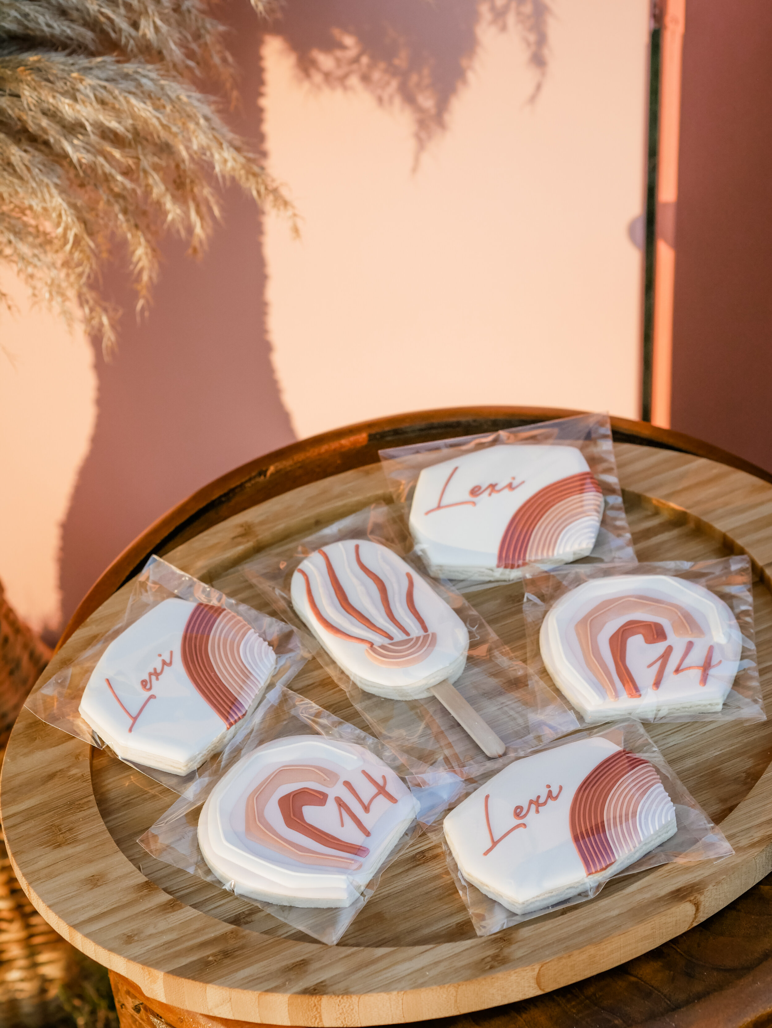  Boho Chic Muted Rainbow Cookies for a luxury backyard Glamping experience - with large rentable tent and picnic area from MINT Event Design in Austin, TX! Perfect for teen slumber parties, birthday parties, or bachelorette parties. See how event des