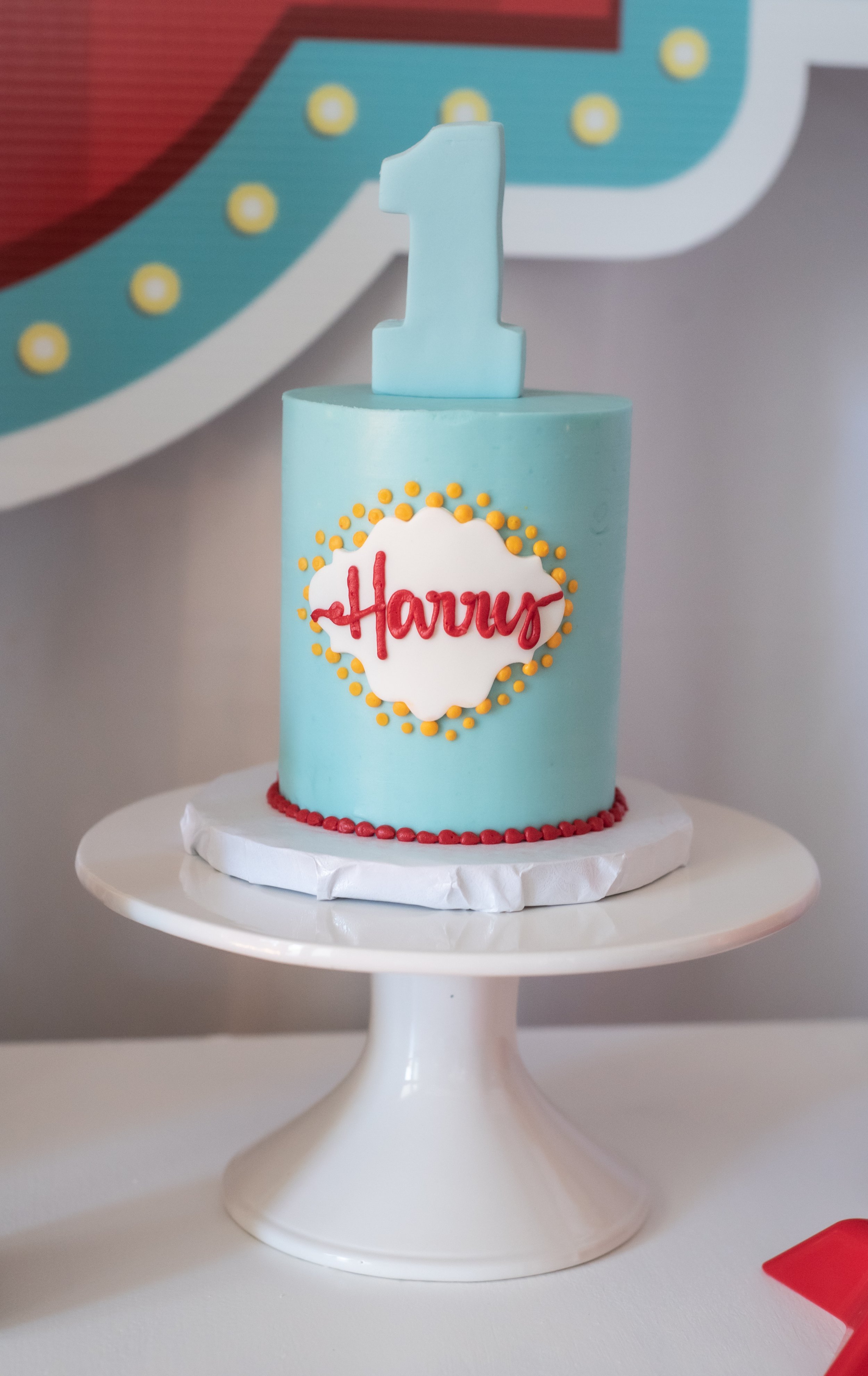 Carnival or circus themed 1st birthday smash cake. Party details at www.minteventdesign.com!