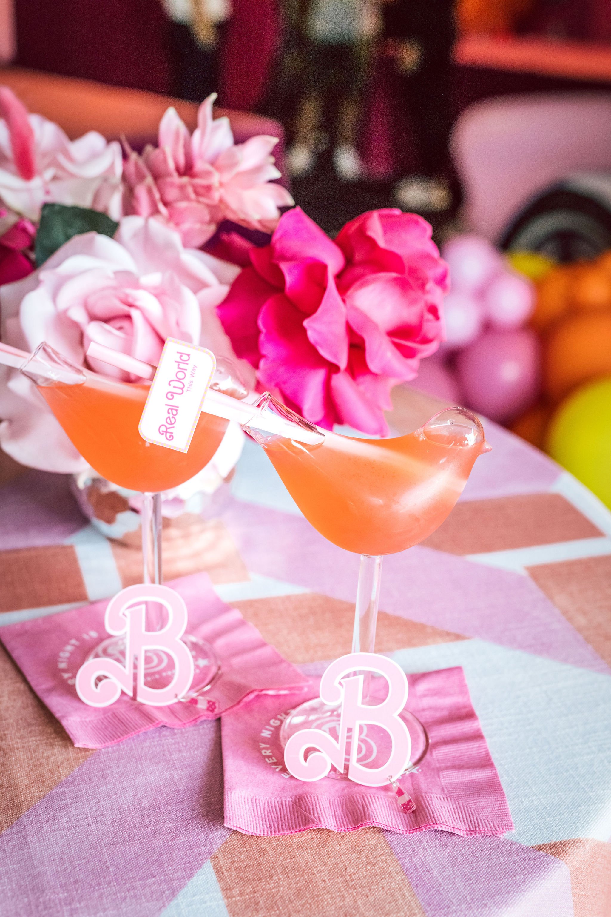 Customized Barbie Party cocktail stirrers. Get more ideas for a Barbie Movie Party at www.minteventdesign.com!