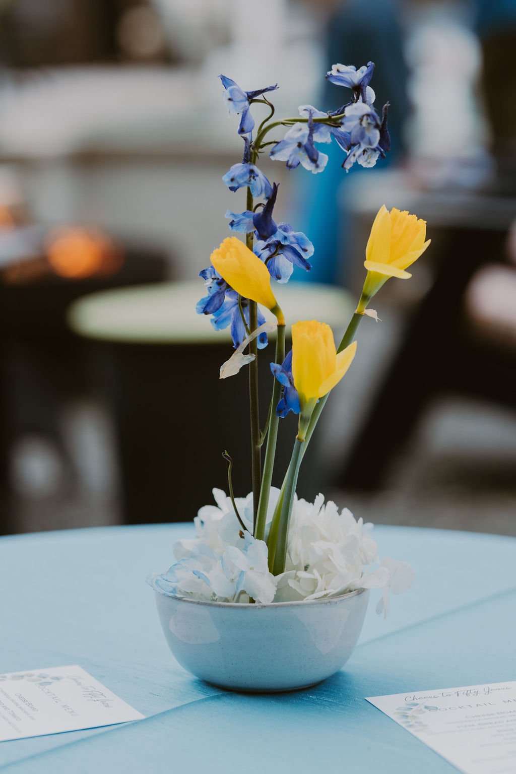 Floral centerpieces at an elegant backyard 50th Birthday Surprise Party. Get more ideas from event designer Carolina of MINT Event Design in Austin, TX at www.minteventdesign.com!