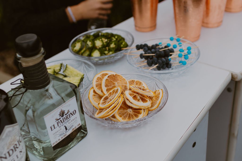 Bar setup at an elegant backyard 50th Birthday Surprise Party. Get more ideas from event designer Carolina of MINT Event Design in Austin, TX at www.minteventdesign.com!