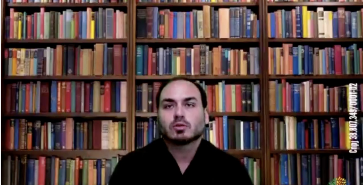 Carlos Bolsonaro, son of the far-right Brazilian President, has  a bookcase stock photo as background . Cheaper than buying books.