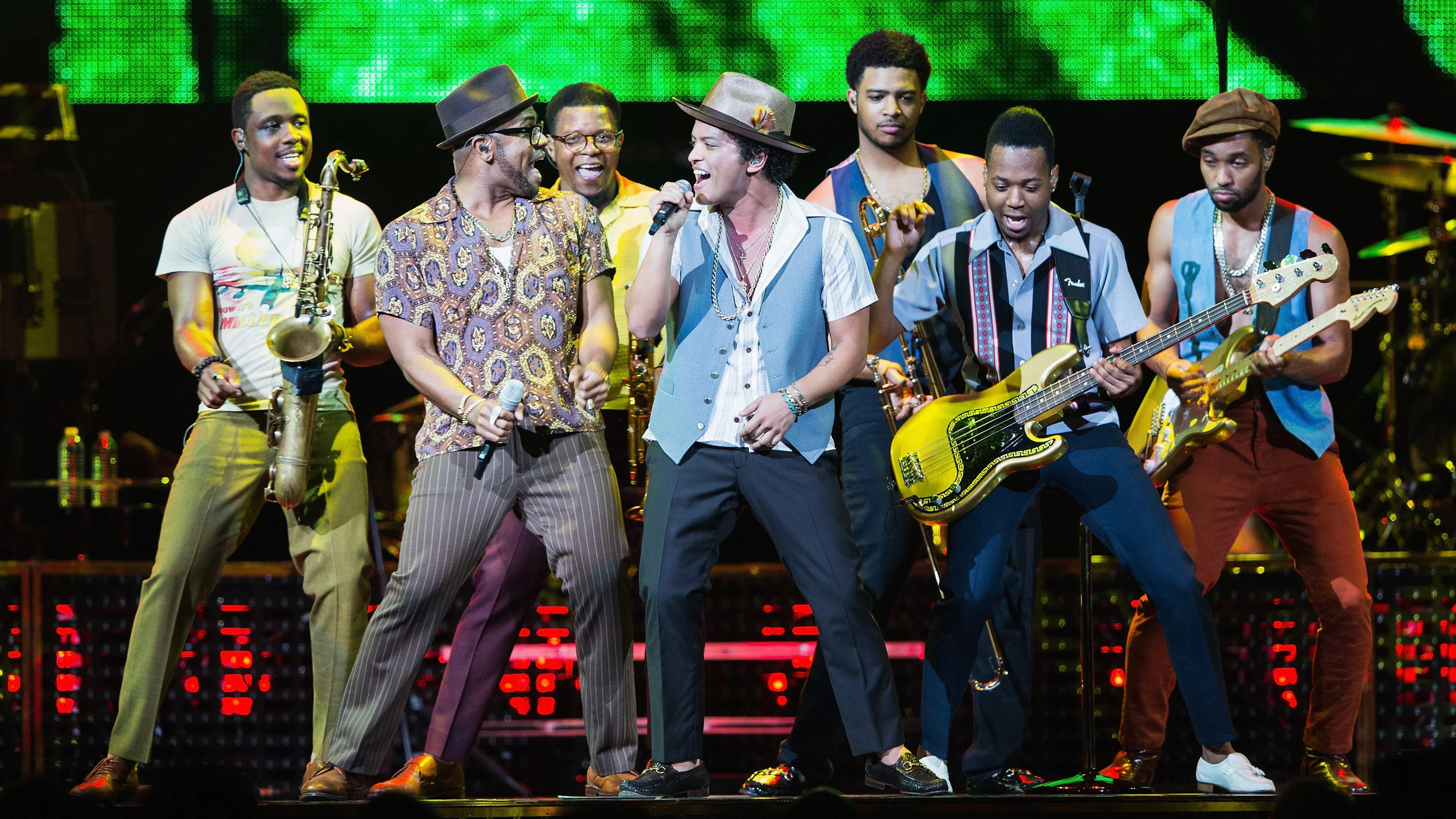Just One Of The Guys: Bruno Mars (center, with microphone) performs with his band at Key Arena in Seattle, Washington on July 21.