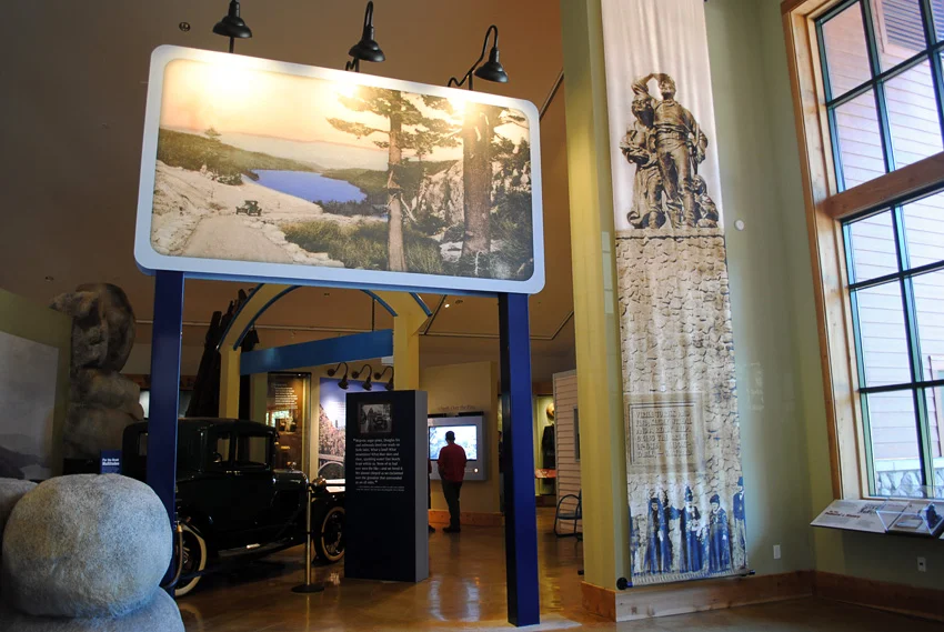 This giant banner features a historic photo of the Donner Memorial that can be seen through that window to the right.